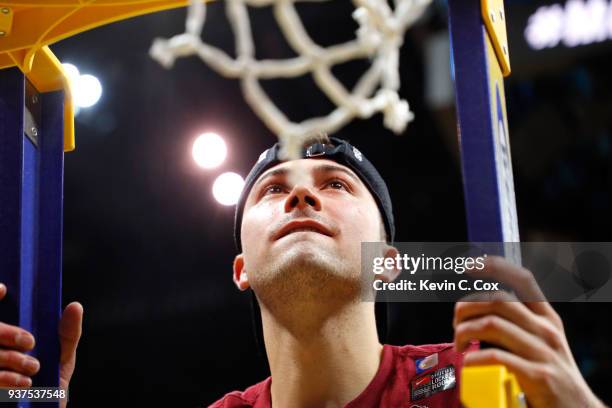 Ben Richardson of the Loyola Ramblers celebrates by cutting down the net after defeating the Kansas State Wildcats during the 2018 NCAA Men's...