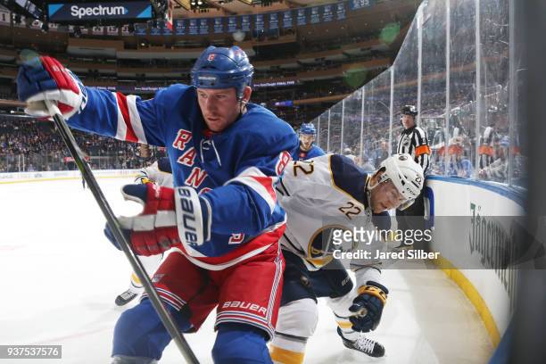 Cody McLeod of the New York Rangers skates against Johan Larsson of the Buffalo Sabres at Madison Square Garden on March 24, 2018 in New York City.