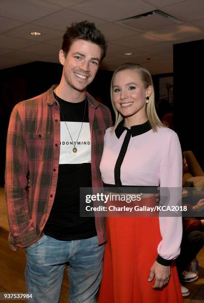 Grant Gustin and Kristen Bell attend Nickelodeon's 2018 Kids' Choice Awards at The Forum on March 24, 2018 in Inglewood, California.