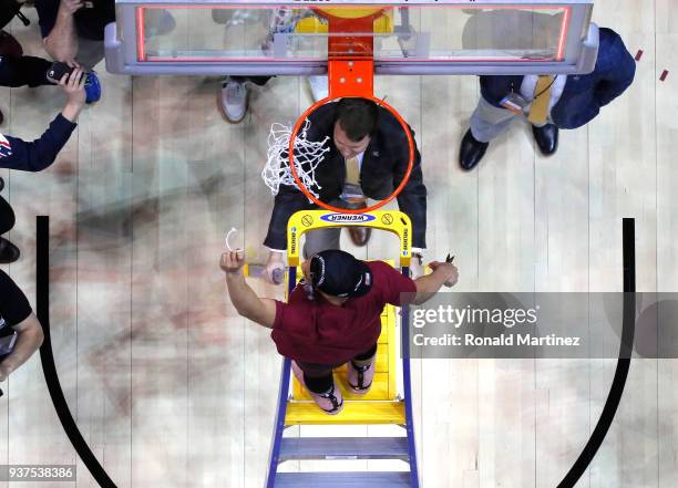 Marques Townes of the Loyola Ramblers celebrates by cutting down the net after defeating the Kansas State Wildcats during the 2018 NCAA Men's...