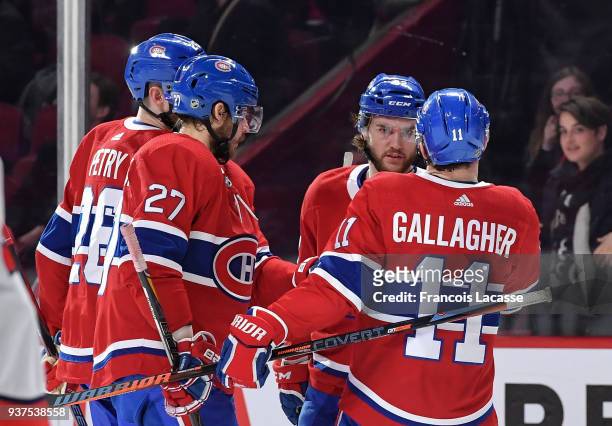 Jonathan Drouin of the Montreal Canadiens celebrates with teammates after scoring a goal against the Washington Capitals in the NHL game at the Bell...