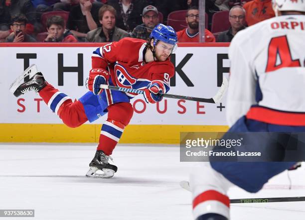 Jonathan Drouin of the Montreal Canadiens fires a slap shot to score a goal against the Washington Capitals in the NHL game at the Bell Centre on...