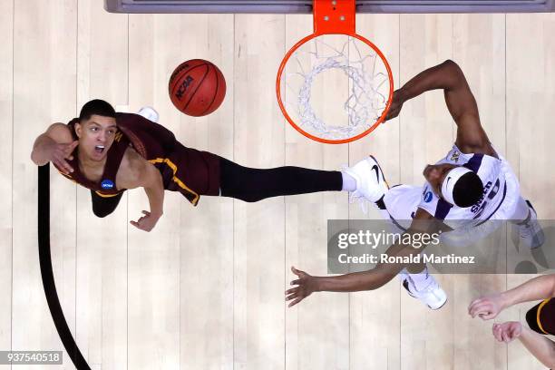 Lucas Williamson of the Loyola Ramblers shoots against Xavier Sneed of the Kansas State Wildcats in the second half during the 2018 NCAA Men's...