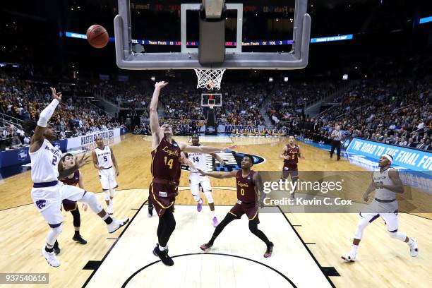 Cartier Diarra of the Kansas State Wildcats shoots against Ben Richardson of the Loyola Ramblers in the second half during the 2018 NCAA Men's...