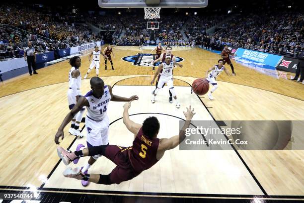 Marques Townes of the Loyola Ramblers dives attempting to save the ball in the first half against Makol Mawien of the Kansas State Wildcats during...