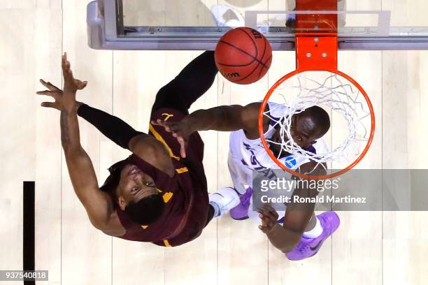 Aundre Jackson of the Loyola Ramblers shoots against Makol Mawien of the Kansas State Wildcats in the second half during the 2018 NCAA Men's...