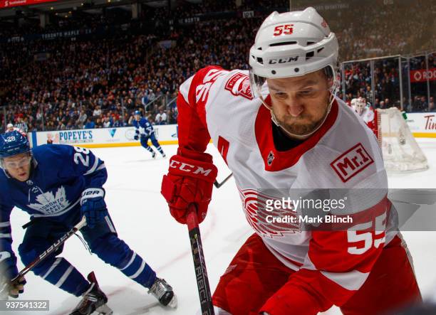 Niklas Kronwall of the Detroit Red Wings skates against Connor Brown of the Toronto Maple Leafs during the third period at the Air Canada Centre on...