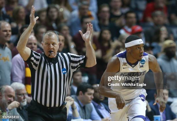 Kansas State's Xavier Sneed hits a 3-pointer against Loyola during the first half in an NCAA Tournament regional final at Philips Arena in Atlanta on...