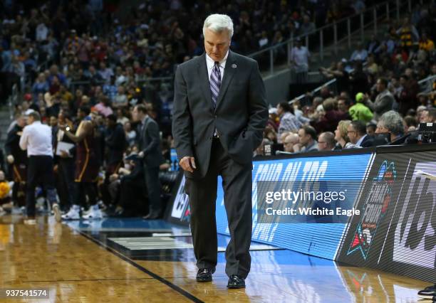 Kansas State head coach Bruce Weber hangs his head as his team falls further behind in the second half against Loyola in an NCAA Tournament regional...