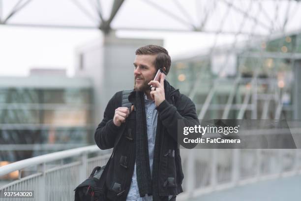 male traveler at airport - male airport stock pictures, royalty-free photos & images