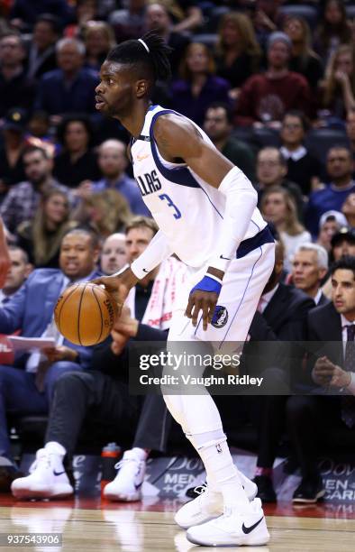 Nerlens Noel of the Dallas Mavericks dribbles the ball during the first half of an NBA game against the Toronto Raptors at Air Canada Centre on March...