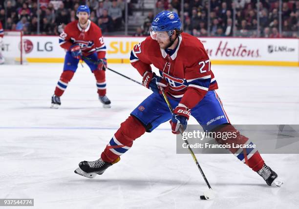 Alex Galchenyuk of the Montreal Canadiens looks to pass the puck against the Pittsburgh Penguins in the NHL game at the Bell Centre on March 15, 2018...