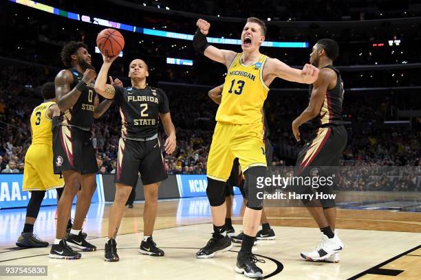 Moritz Wagner of the Michigan Wolverines reacts after making a basket and getting fouled in the second half while taking on the Florida State...