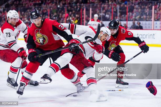 Carolina Hurricanes Center Sebastian Aho falls after getting tangled up with Ottawa Senators Defenceman Fredrik Claesson during third period National...