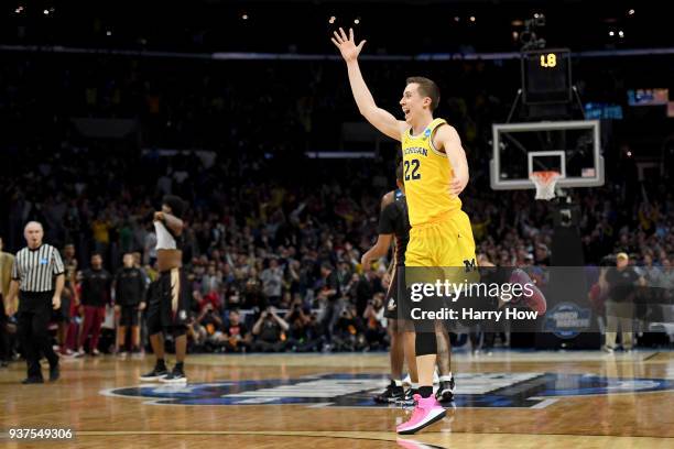 Duncan Robinson of the Michigan Wolverines celebrates the Wolverines 58-54 win against the Florida State Seminoles in the 2018 NCAA Men's Basketball...