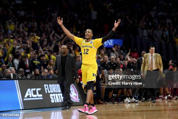 Muhammad-Ali Abdur-Rahkman of the Michigan Wolverines celebrates the Wolverines 58-54 win against the Florida State Seminoles in the 2018 NCAA Men's...