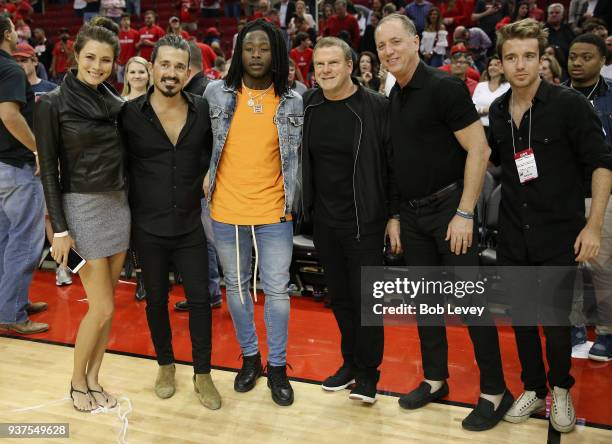 Houston Rockets owner Tilman Fertitta, fourth from left, poses with Sydney Torres IV, 2nd from left and New Orleans Saints running back Alvin Kamara,...