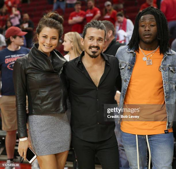 Sydney Torres IV, center, and guest with New Orleans Saints running back Alvin Kamara at Toyota Center on March 24, 2018 in Houston, Texas. NOTE TO...