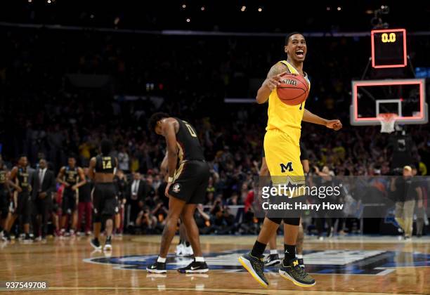 Charles Matthews of the Michigan Wolverines celebrates the Wolverines 58-54 win against the Florida State Seminoles in the 2018 NCAA Men's Basketball...