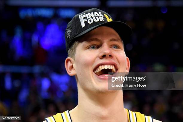 Moritz Wagner of the Michigan Wolverines celebrates the Wolverines 58-54 win against the Florida State Seminoles in the 2018 NCAA Men's Basketball...