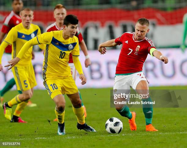 Balazs Dzsudzsak of Hungary competes for the ball with Baktiyor Zaynutdinov of Kazakhstan during the International Friendly match between Hungary and...