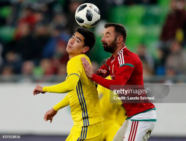 Attila Fiola of Hungary competes for the ball with Erkebulan Tungyshbayev of Kazakhstan during the International Friendly match between Hungary and...