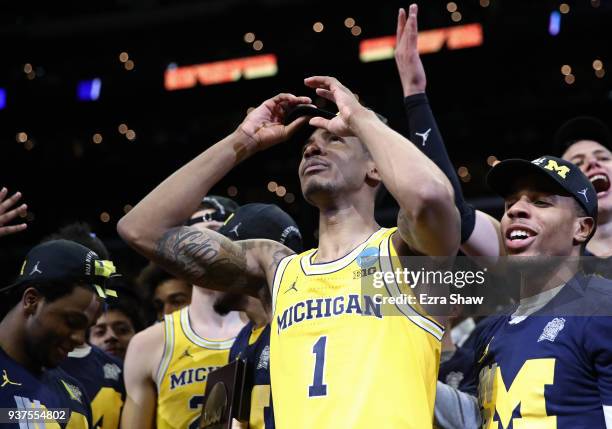 Charles Matthews of the Michigan Wolverines celebrates after defeating the Florida State Seminoles in the 2018 NCAA Men's Basketball Tournament West...