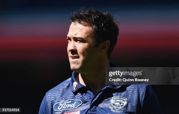 Cats head coach Chris Scott looks on during the round one AFL match between the Melbourne Demons and the Geelong Cats at Melbourne Cricket Ground on...