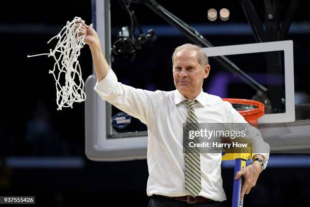 Head coach John Beilein of the Michigan Wolverines cuts down the net after the Wolverines 58-54 victory against the Florida State Seminoles in the...
