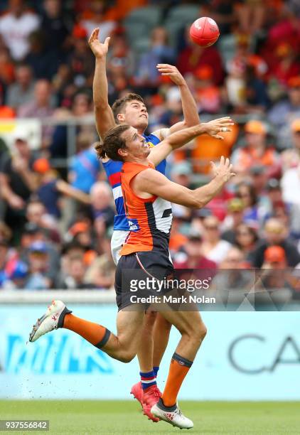 Phil Davis of the Giants and Josh Dunkley of the Bulldogs contest possession during the round one AFL match between the Greater Western Sydney Giants...