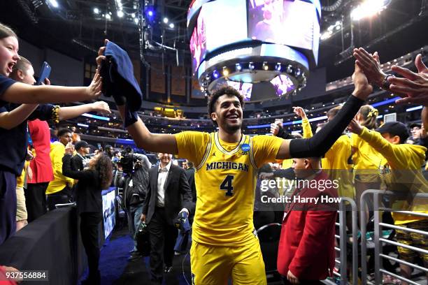 Isaiah Livers of the Michigan Wolverines walks off the court after defeating the Florida State Seminoles in the 2018 NCAA Men's Basketball Tournament...