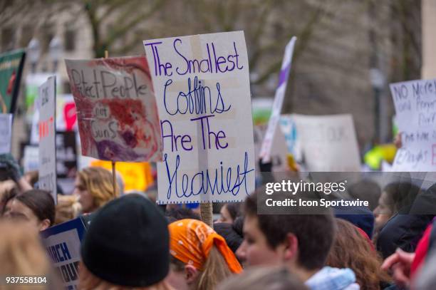 Protester sign denouncing the deaths of children in mass shootings during the March for Our Live on March 24 in downtown Portland, OR.