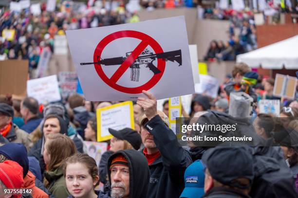 Protesters show their support for an assault weapon ban during the March for Our Live on March 24 in downtown Portland, OR.
