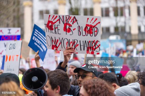 Protesters denounce the NRA to protest school shootings and to demand gun control during the March for Our Live on March 24 in downtown Portland, OR.