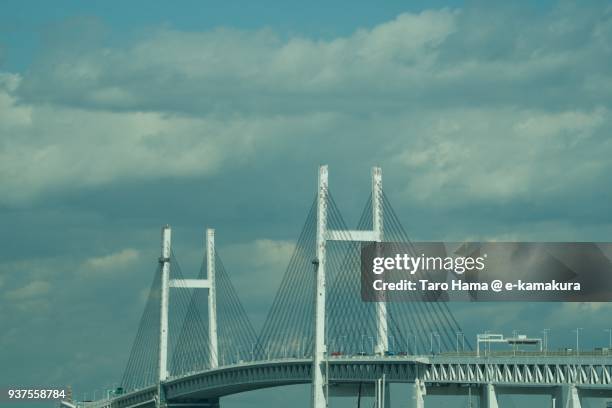 yokohama bay bridge in yokohama harbor in yokohama city in kanagawa prefecture in japan - yokohama brücke stock-fotos und bilder