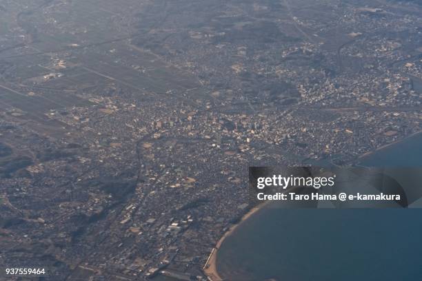 mikawa bay and tsu city in mie prefecture in japan daytime aerial view from airplane - tsu stock pictures, royalty-free photos & images