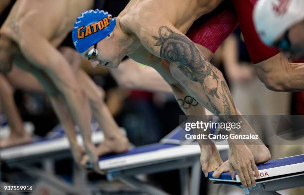 Caeleb Dressel of Florida prepared to leave the starting blocks of the 100 yard freestyle during the Division I Men's Swimming & Diving Championship...