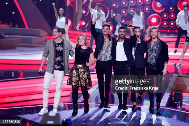 Vincent Gross, Laura Wilde and the band Feuerherz perform during the tv show 'Willkommen bei Carmen Nebel' on March 24, 2018 in Hof, Germany. The...