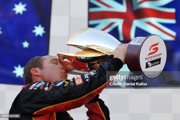 Race winner David Reynolds driver of the Erebus Penrite Racing Holden Commodore ZB celebrates on the podium during race 4 for the Supercars...