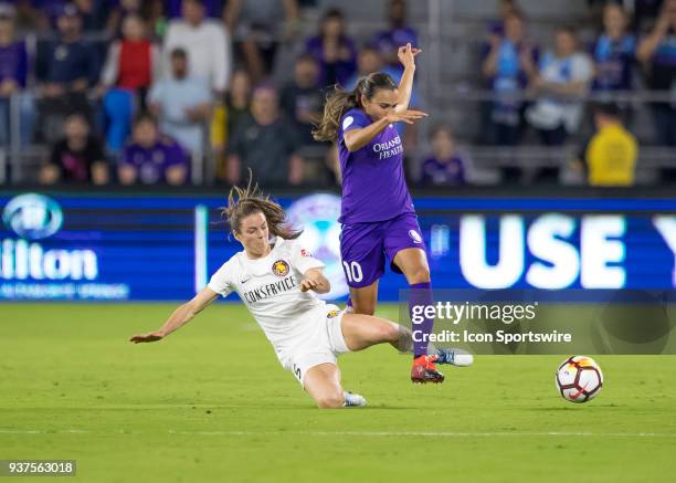 Utah Royals FC defender Kelley O'Hara clears Orlando Pride forward Marta from possessing the ball during the NWSL soccer match between the Orlando...