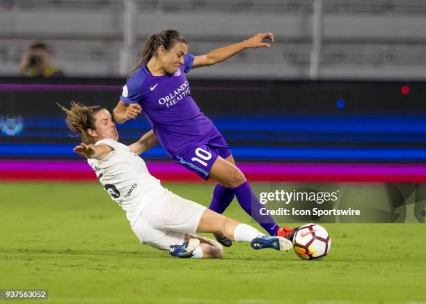 Utah Royals FC defender Kelley O'Hara slides tackles Orlando Pride forward Marta during the NWSL soccer match between the Orlando Pride and the Utah...