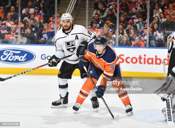 Ryan Nugent-Hopkins of the Edmonton Oilers battles for position against Drew Doughty of the Los Angeles Kings on March 24, 2018 at Rogers Place in...