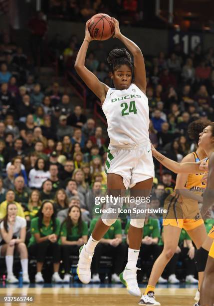 Oregon forward Ruthy Hebard pulls down a rebound during a Division I Women's Championship, Third Round game between the Central Michigan Chippewas...