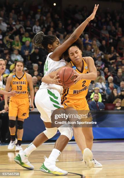 Central Michigan forward Tinara Moore fights to get past Oregon forward Ruthy Hebard during a Division I Women's Championship, Third Round game...