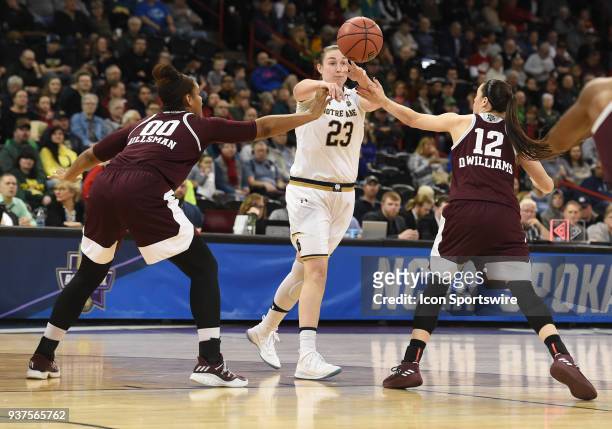 Notre Dame forward Jessica Shepard delivers a pass between the defense of Texas A&M center Khaalia Hillsman and guard Danni Williams during the 1st...