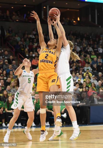 Oregon forward Mallory McGwire grabs this rebound over Central Michigan forward Tinara Moore during a Division I Women's Championship, Third Round...
