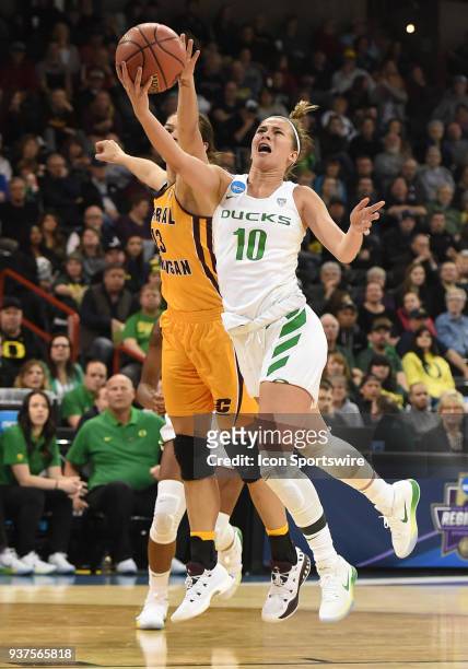Oregon guard Lexi Bando scores on this layup during a Division I Women's Championship, Third Round game between the Central Michigan Chippewas and...
