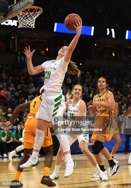 Oregon guard Sabrina Ionescu pulls down an offensive rebound during a Division I Women's Championship, Third Round game between the Central Michigan...