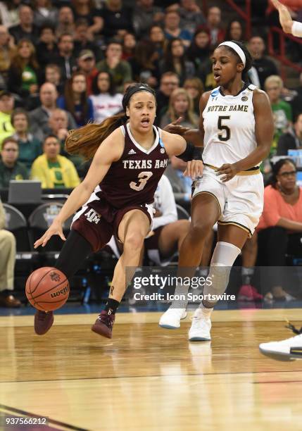 Texas A&M guard Chennedy Carter tries to drive past Notre Dame guard Jackie Young during the 2nd half of a Division I Women's Championship, Third...