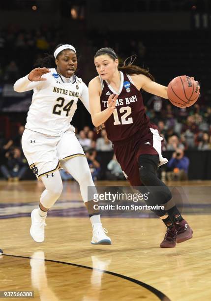 Texas A&M guard Danni Williams drives on Notre Dame guard Arike Ogunbowale during the 2nd half of a Division I Women's Championship, Third Round game...